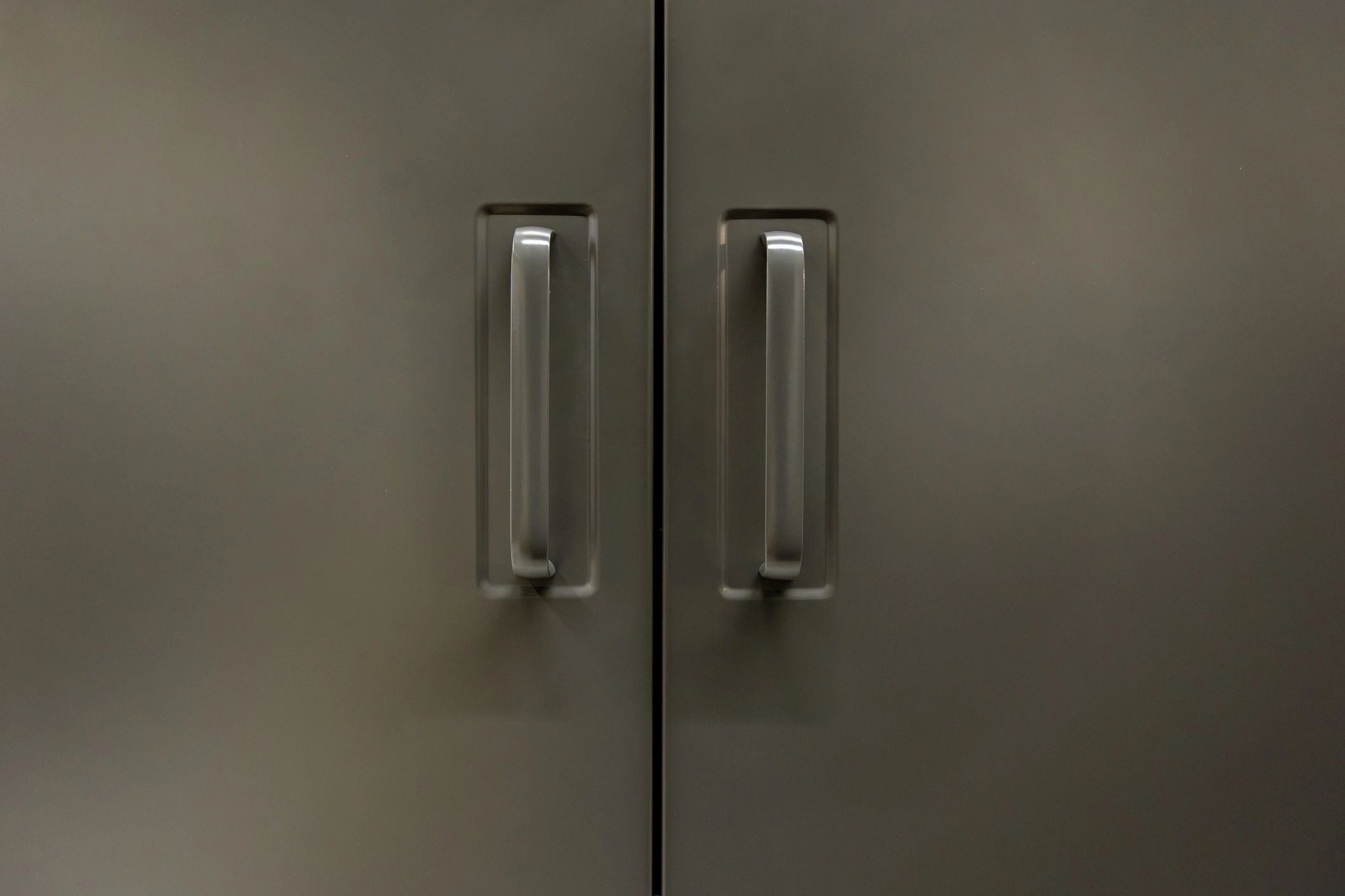 Minimal cabinet facade with symmetrical hardware and clean lines